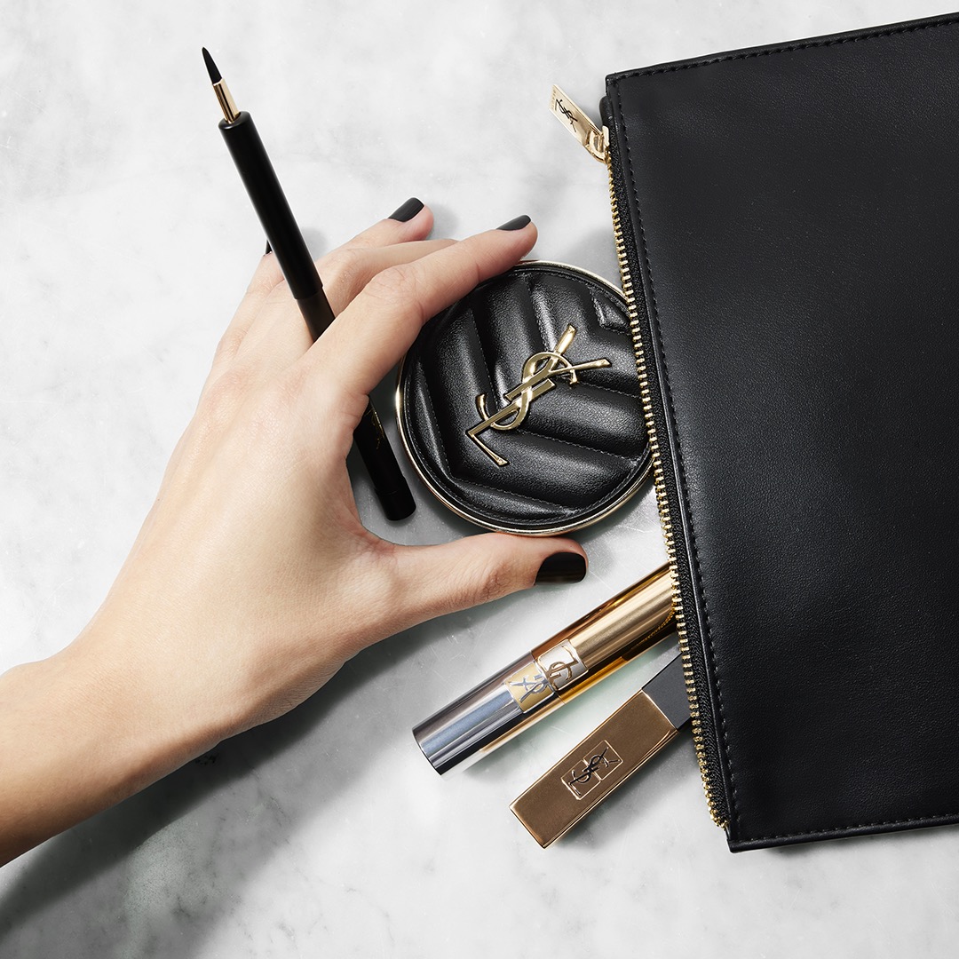 Model's hand with black nail polish removing